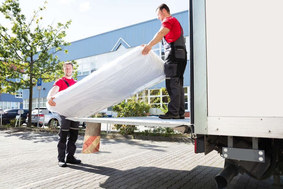 בסט לינק depositphotos Young Men Unloading The Mattress From Truck On Street